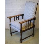 RECLINING ARMCHAIR, early 20th century oak, circa 1920 with ratchet adjustable back and cushion seat