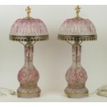 LAMPS, a pair, Bohemian 20th century cut glass, peach tinted with metal pierced mounts and figural