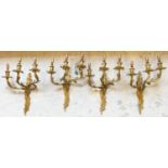 WALL LIGHTS, a set of four, Louis XV design gilt metal with three branches, 48cm H. (3)