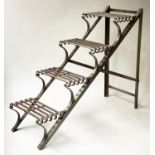 FOLDING STEPS, formed iron slatted four tread and folding, 88cm H x 42cm x 107cm.