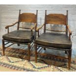 ARMCHAIRS, a pair, Arts and Crafts Liberty style with ring turned supports and leather squab
