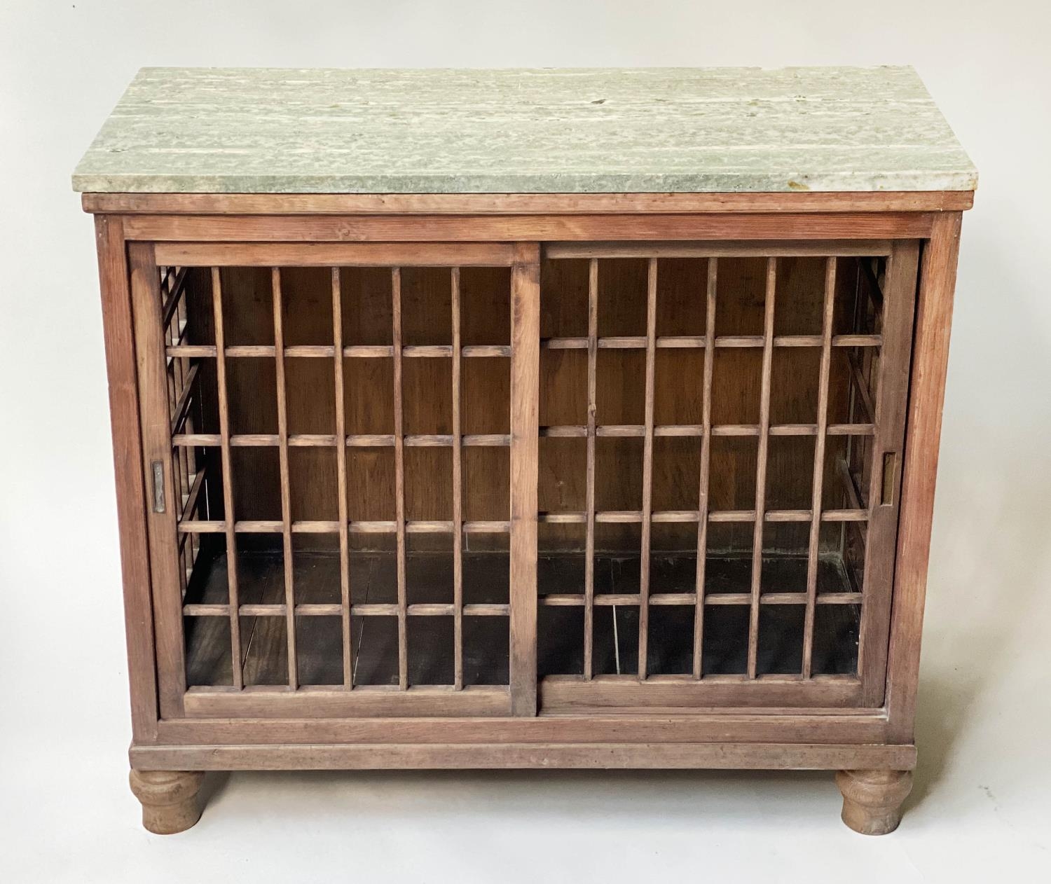 PLATE CABINET, stained deal with lattice sliding doors and marble top and turned feet, 87cm x 40cm x