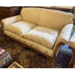 SOFA, early 20th century walnut in damask upholstery with carved show frame and claw and ball