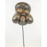 ROYAL BAUMWN MASK, from Cameroon, with puffed out cheeks, made as a symbol of power and authority,