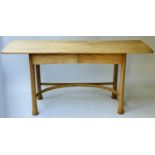 ERCOL WRITING TABLE, 20th century Art Nouveau inspired solid elm with two frieze drawers and