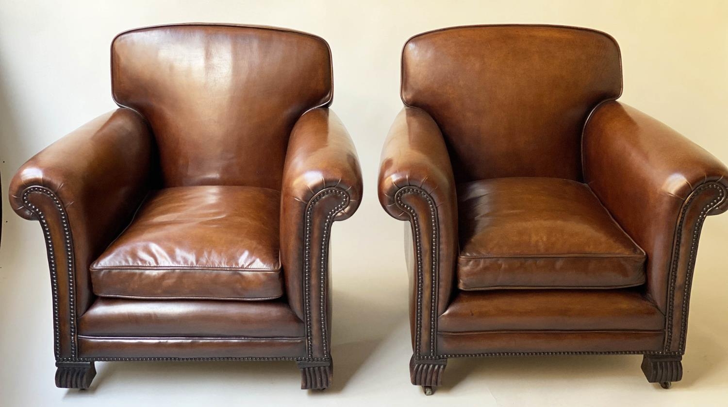 CLUB ARMCHAIRS, a pair, French Art Deco period with hand dyed leaf brown piped and studded - Image 8 of 9