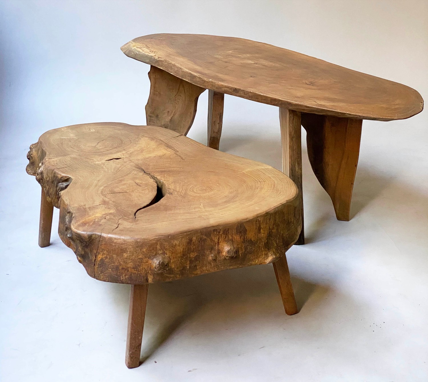 RUSTIC LOW TABLE, burr yewwood tree section on shaped supports together with a lower example,
