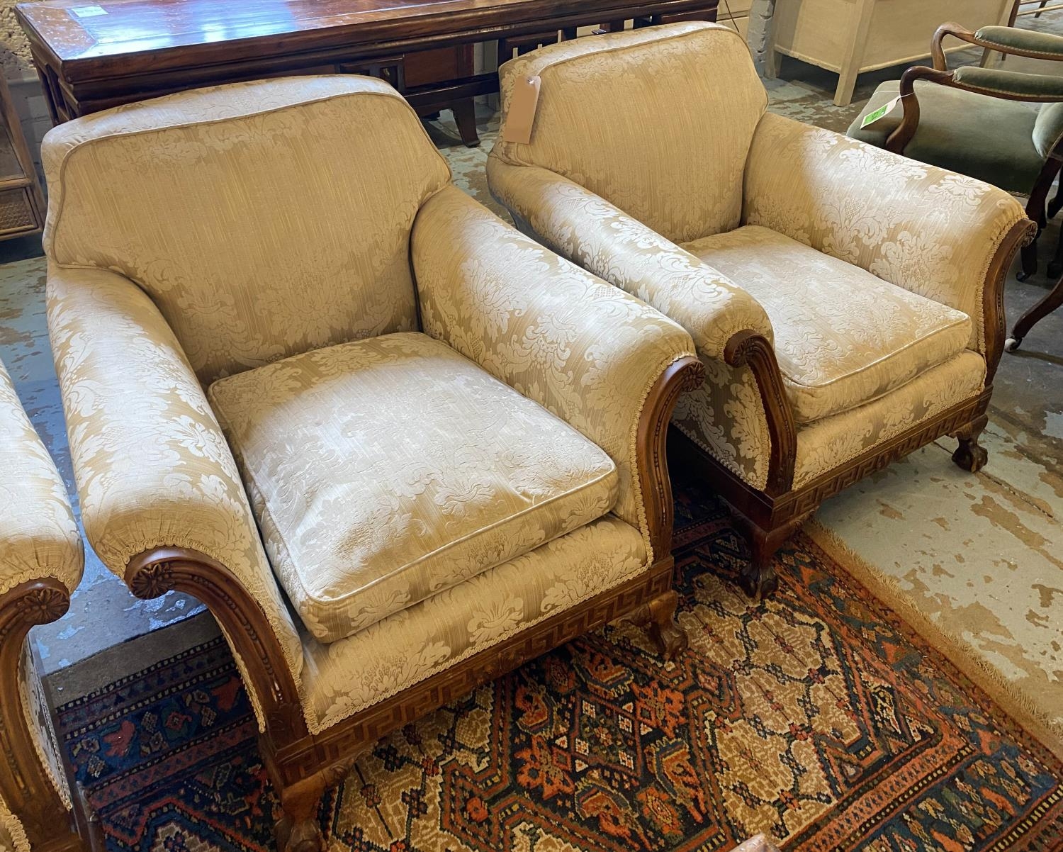 ARMCHAIRS, a pair, matching previous lot with damask upholstery with carved show frames and claw and