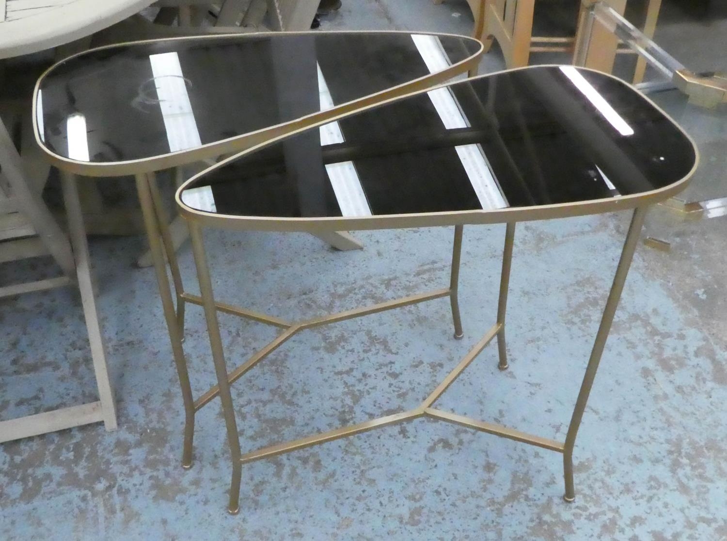 SIDE TABLES, a pair, 1950's Italian style, gilt metal, smoked glass tops, 70cm x 36cm x 71cm. (2)