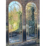 ARCHITECTURAL STYLE MIRRORS, a pair, 180cm x 63cm, metal framed with an arched top. (2)
