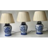 TABLE LAMPS, a set of three, Chinese blue and white ceramic of ginger jar form with pleated