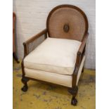 BERGERE, 69cm x 75cm, circa 1910, mahogany and caned with white seat cushions.