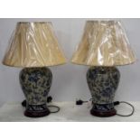 CHINESE STYLE TABLE LAMPS, a pair, foliate decorated, each with a shade, 65cm H. (2)