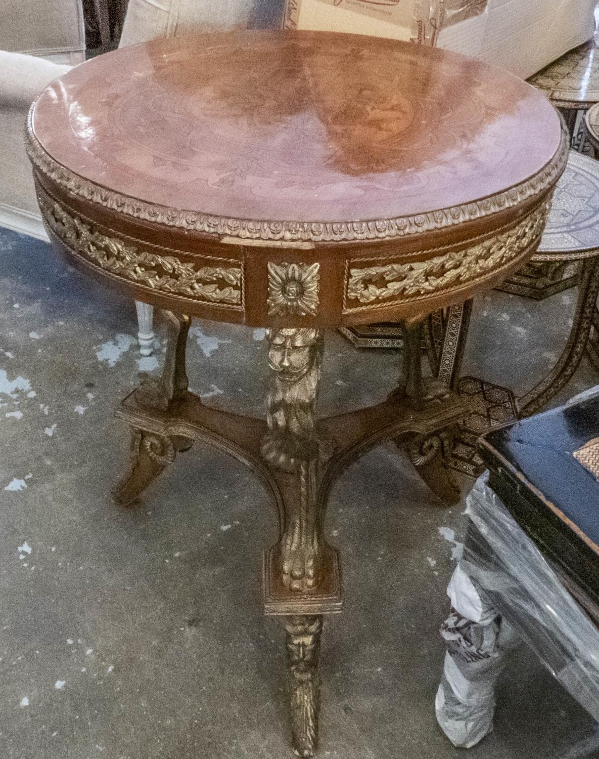 OCCASIONAL TABLE, circular with marquetry and gilt metal mounts on lion supports, 61cm W x 78cm H.