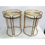 SIDE TABLES, a pair, 1970's Italian style, gilt metal with glass tops, 53cm H x 39cm diam. (2)