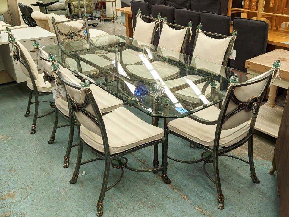 DINING TABLE, 111cm x 221cm x 74cm H, the glass top on a metal base and eight chairs, including