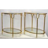 OCCASIONAL TABLES, a pair, two tier, each with an oval glass top, 36cm x 50cm H x 56cm. (2)