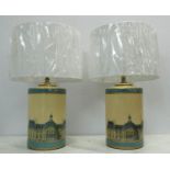 TABLE LAMPS, a pair, each with detail of the Louvre and a cream shade, 59cm H. (2)