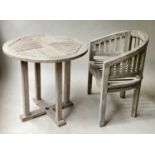 GARDEN TABLE, circular slatted weathered teak together with a Java teak garden armchair, 80cm diam x
