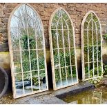 ARCHITECTURAL GARDEN MIRRORS, three, 157.5cm x 66cm, aged metal frames. (3)