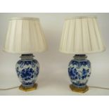 LAMPS, a pair, 19th century French Faience, blue and white foliate Chine style decoration