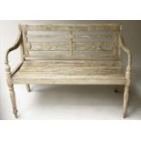 VERANDAH BENCH, silvery weathered teak Anglo-Indian with carved pierced backs and slatted seats,