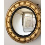 CONVEX WALL MIRROR, Regency style giltwood circular sphere encrusted with ebonised slip and convex