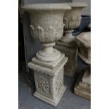 GARDEN URNS ON PLINTHS, two, 113cm H composite stone with acanthus detail. (2)