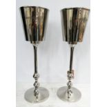 CHAMPAGNE BUCKETS ON STANDS, two, 79cm H, polished metal. (2)