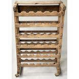 WINE RACK, vintage French fruitwood and brass studded with castors, 92cm H x 56cm W x 31cm D.