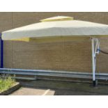 LARGE GARDEN PARASOL/CANOPY, approx 4.2 metres square, cream canvas, retractable with side mounts.