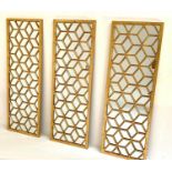 ARCHITECTURAL ACCENT WALL MIRRORS, three, 120cm x 40cm, gilt frames. (3)