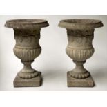 GARDEN URNS/PLANTERS, a pair, weathered reconstituted stone of campana form and socle support,