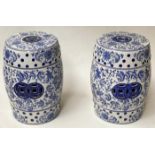 CHINESE STOOLS, a pair, 45cm H pierced blue and white ceramic, of barrel form. (2)