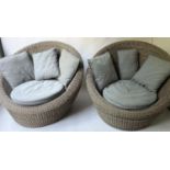 EASY ARMCHAIRS, 122cm W, a pair, grey rattan, of rounded design, each with grey seat and scatter