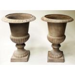 PLANTERS/URNS, a pair, well weathered campana cast iron with square bases, 67cm H x 50cm. (2)