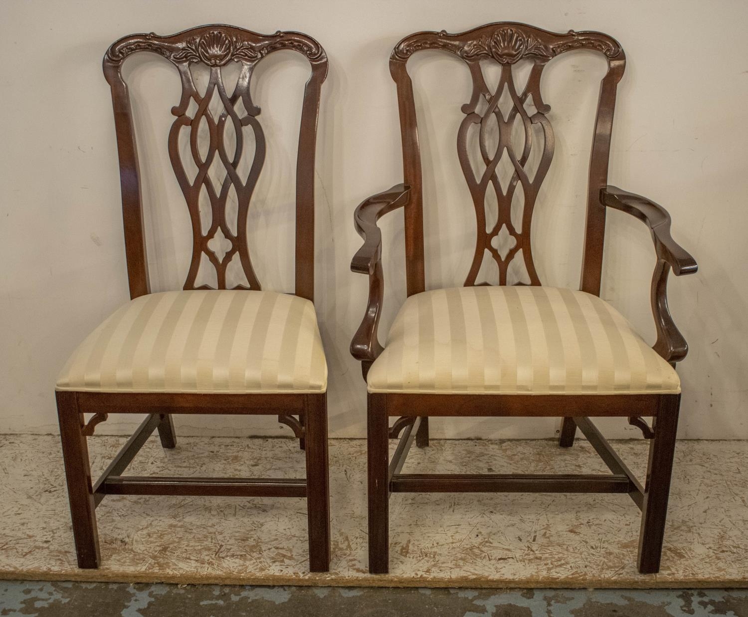 DINING CHAIRS, a set of twelve, Chippendale style, including two armchairs with cream damask