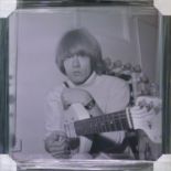 ROLLING STONES BRIAN JONES PHOTOGRAPH, 1.0 Mann 1965, 52cm x 52cm, framed.