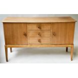 GORDON RUSSELL SIDEBOARD, 1960's walnut with three drawers and two doors stamped 'Russell Broadway',