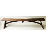 BENCH, antique oak with rectangular seat and arched stretcher on jointed trestle, 187cm x 28cm x