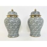 TEMPLE JARS, a pair, 43cm H with covers. (2)