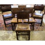 DINING CHAIRS, a set of four, early 20th century oak in brown leather and a similar pair of