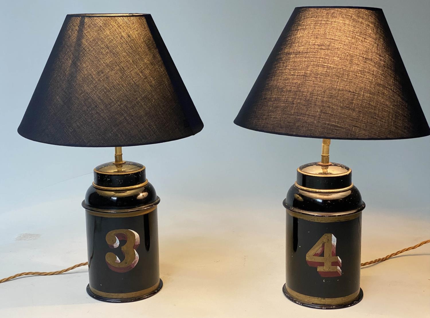 TEA CANNISTER LAMPS, a pair, painted toleware early 20th century adapted with shades, 48cm H. (2)