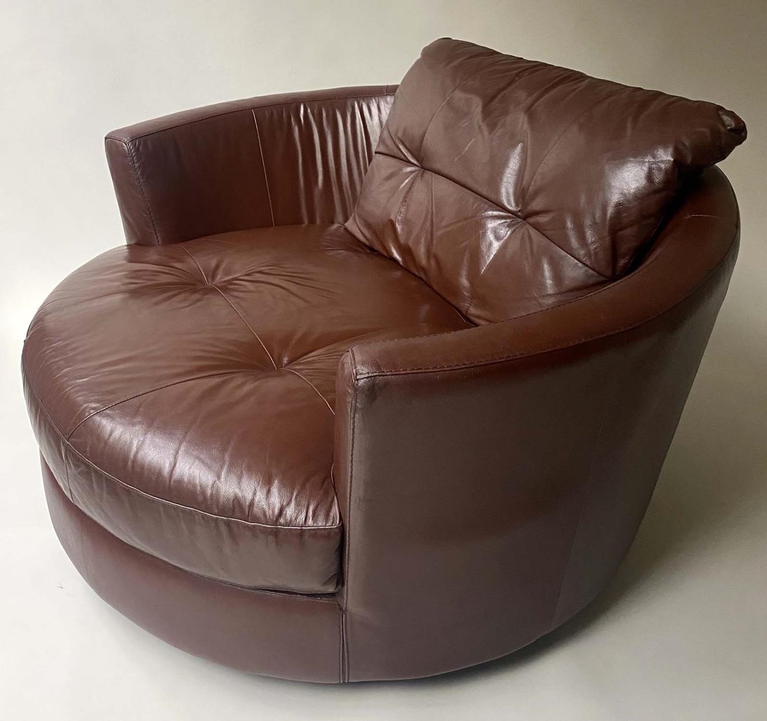 EASY REVOLVING ARMCHAIR, oversized grained tan leather, 132cm W.