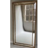 WALL MIRROR, George III style giltwood rectangular with marginal cushion plates, 101cm x 191cm H.