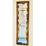 VENETIAN PIER MIRROR, 140cm H x 40cm W, rectangular, 19th century, leaf carved giltwood and traces