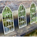 ARCHITECTURAL GARDEN MIRRORS, three, 96cm x 40cm, aged white painted frames. (3)