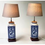 TABLE LAMPS, a pair, blue and white Chinese ceramic with dragon panelled sides, carved wooden base