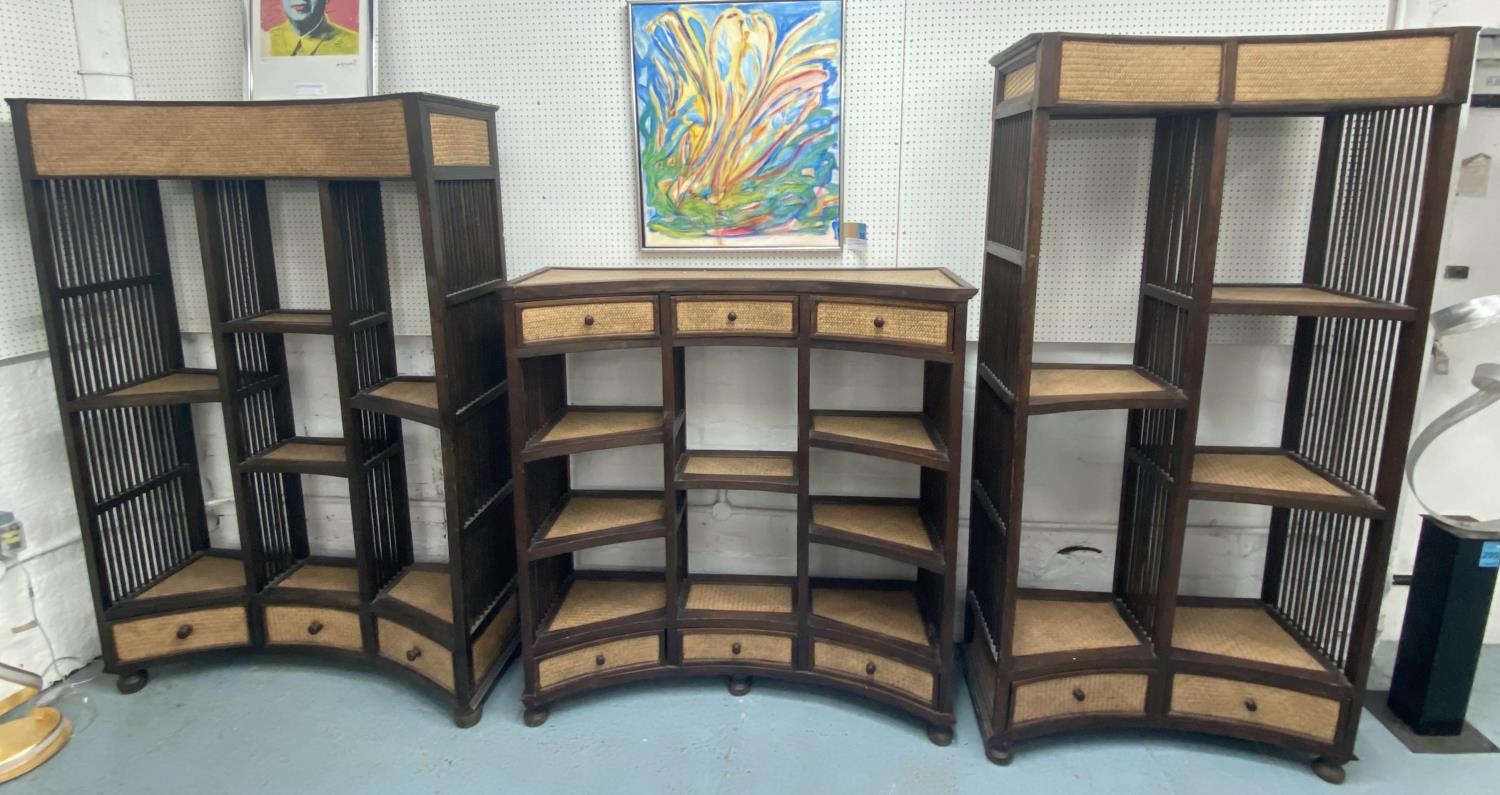 CONCAVE OPEN DISPLAY SHELVES, a set of three, South East Asian rattan and hardwood, largest 129cm