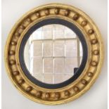WALL MIRROR, Regency giltwood circular with ball encrusted frame and ebonised slip, 46cm W.